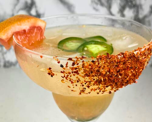 Savor the zesty kick of a Spicy Grapefruit Margarita: a refreshing cocktail with a hint of heat, perfect for summer gatherings and relaxing evenings.